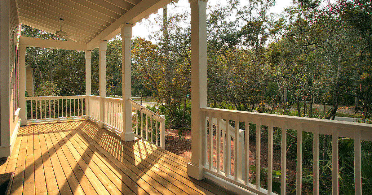 White railing porch with ceiling fans
